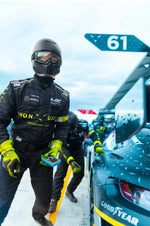 Measuring tire pressure in the Imola race pit stop.